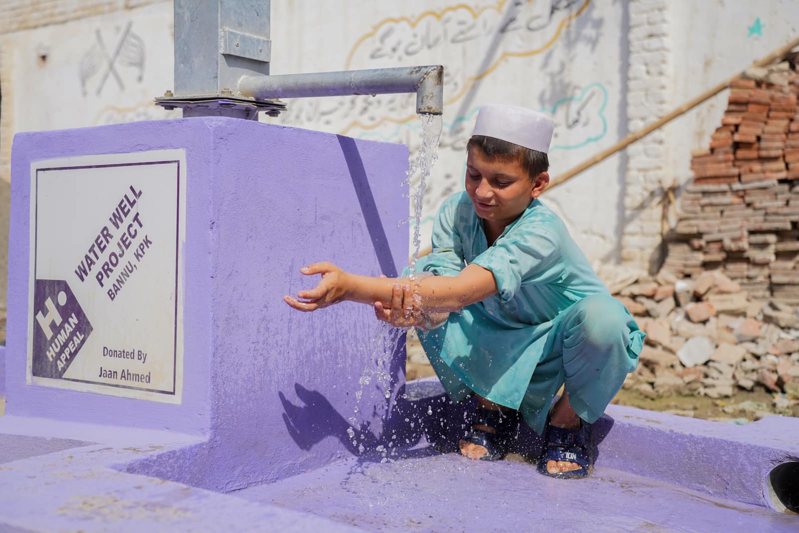 A Human Appeal water well bringing clean water to a village